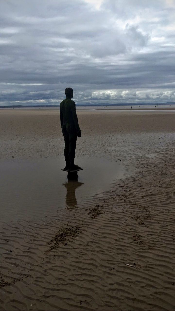 sea, horizon over water, beach, water, sky, full length, lifestyles, shore, leisure activity, rear view, cloud - sky, tranquil scene, tranquility, sand, standing, scenics, beauty in nature, nature