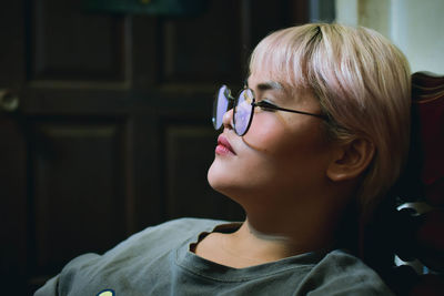 Close-up portrait of woman looking away