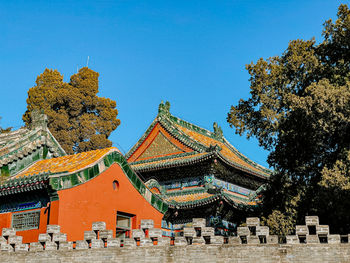 Low angle view of traditional building against clear blue sky