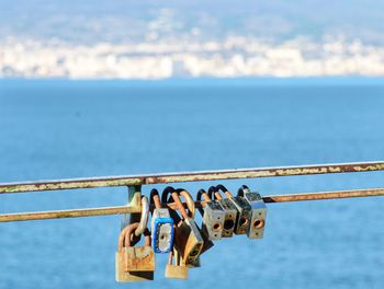 Group of people on railing against sea