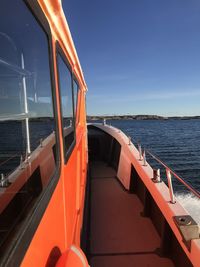 Boat sailing in sea against sky