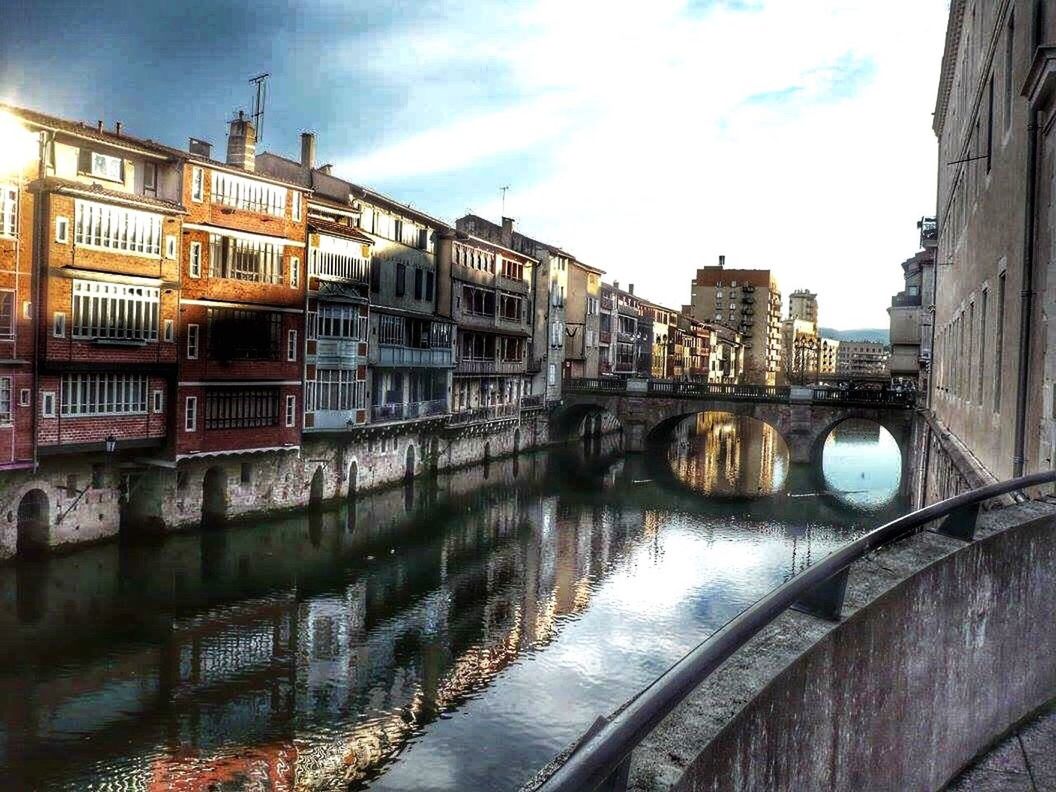 architecture, built structure, water, canal, building exterior, bridge - man made structure, reflection, travel destinations, city, sky, railing, outdoors, connection, no people, day, cityscape