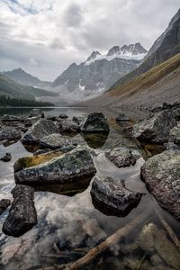 Scenic view of rocks and mountains against sky