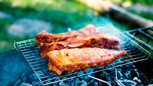 Close-up of meat on barbecue grill