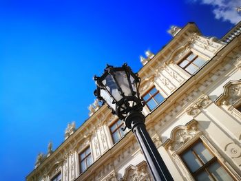 Low angle view of building against blue sky