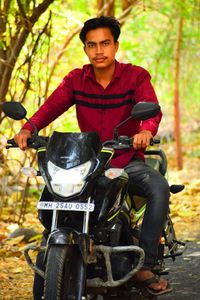 Portrait of young man riding bicycle