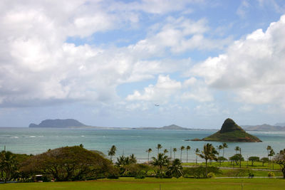 Scenic view of sea against cloudy sky