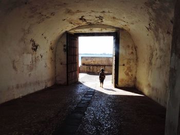 Rear view of child at doorway