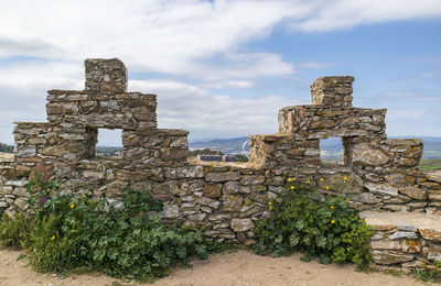 Old ruin building against cloudy sky