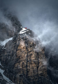 Rock formation on mountain against sky