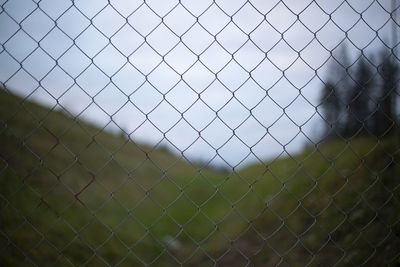 Fence net. steel mesh on background of landscape. repeating element. 