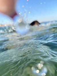 Close-up of man swimming in sea