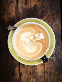 High angle view of cappuccino on table