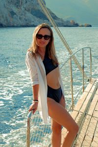 Beautiful woman resting on a yacht in the mediterranean sea