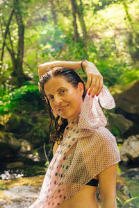 Portrait of young woman standing outdoors