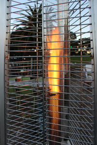 Close-up of metal grate against window