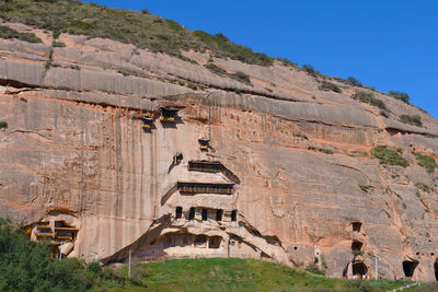 Built structure on mountain against the sky