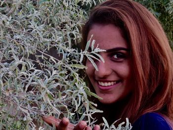 Portrait of smiling young woman outdoors