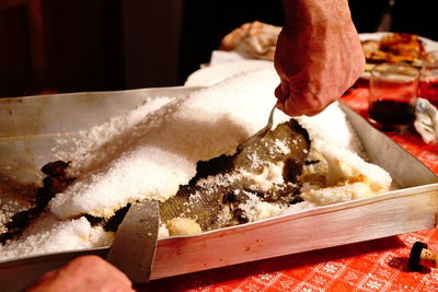 Close-up of person preparing food