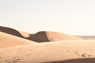 Scenic view of desert against clear sky