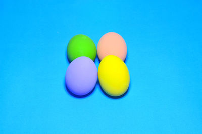 Close-up of multi colored candies against blue background