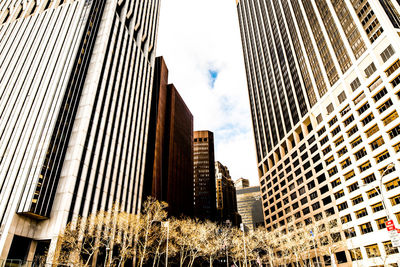 Low angle view of skyscrapers against sky