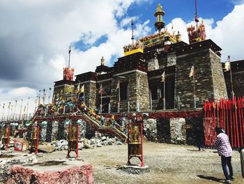 Traditional temple against cloudy sky