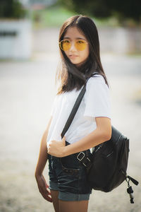 Portrait of girl standing on land