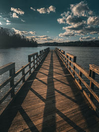 Pier over sea against sky