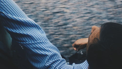 High angle view of man sitting in moving train