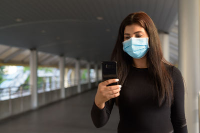 Young woman using mobile phone