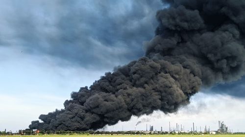 Smoke rises from the pertamina oil tank fire