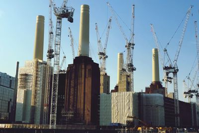 Low angle view of modern buildings in city against sky