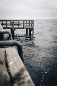 Pier over sea against sky. 