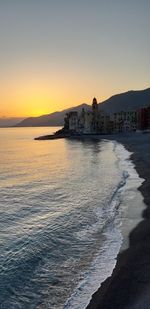 Scenic view of sea against clear sky during sunset