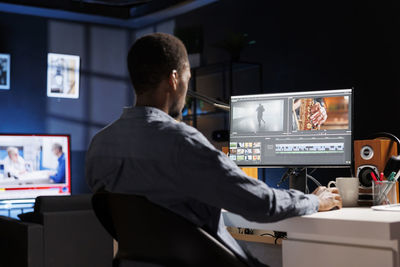Side view of man working at home
