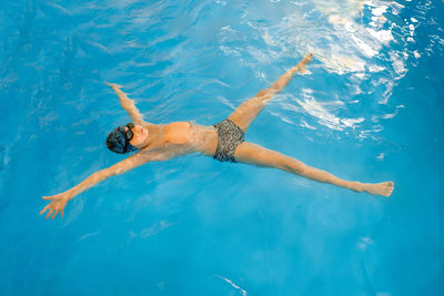 High angle view of woman swimming in pool