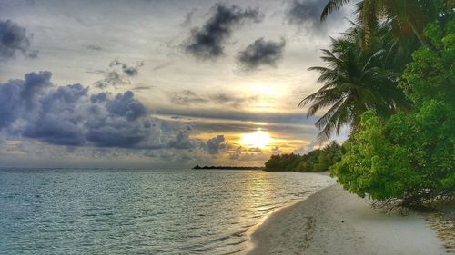 Scenic view of sea against sky at sunset