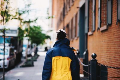 Rear view of man in city