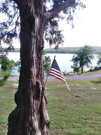 Traditional windmill on field against sky