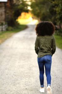 Rear view of girl walking outdoors