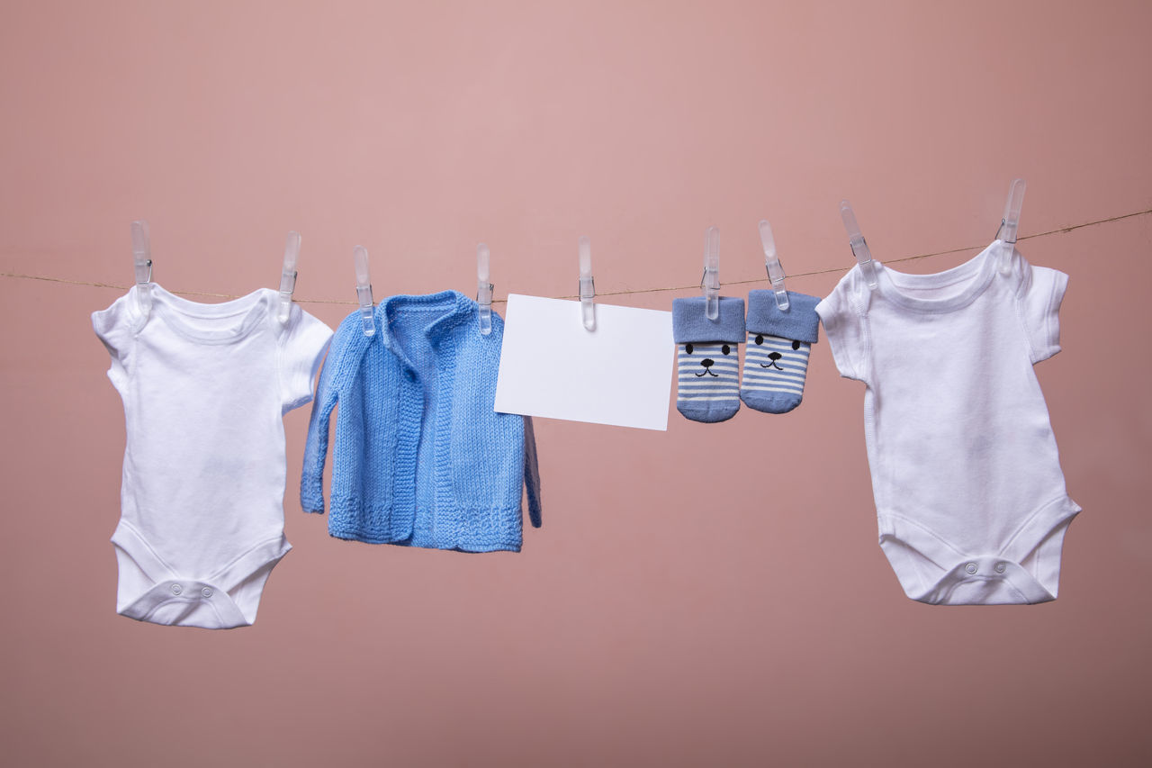 CLOSE-UP OF CLOTHES HANGING ON CLOTHESLINE