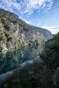 Verdon river surrounded by medium cliffs early morning with fog, lower verdon gorges, france