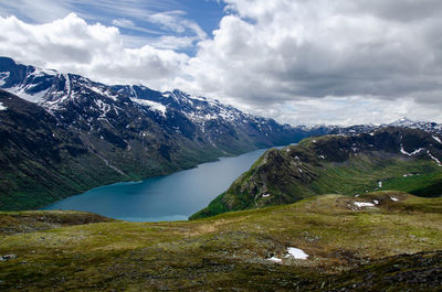 Scenic view of snowcapped mountains against sky