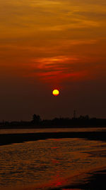 Scenic view of sea against romantic sky at sunset