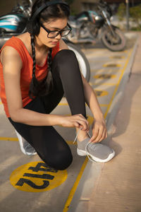 Low section of woman exercising in gym