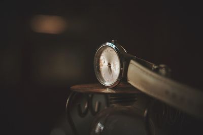 Close-up of clock on table