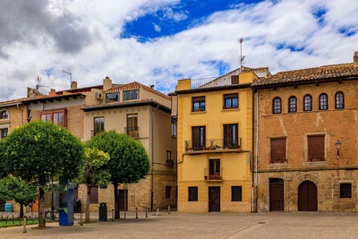 Buildings in city against sky