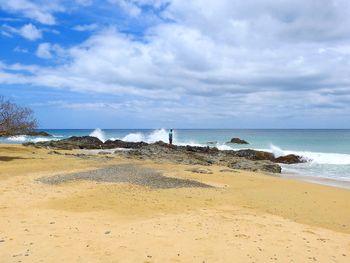 Scenic view of beach against sky