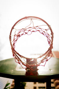 Close-up of basketball hoop against sky